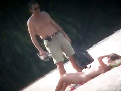 Spy cam shot of a hot young couples outdoor sex blond tanning on the beach