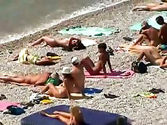 Muscular men and sleek women on a bisex theater beach candid video