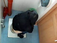Toilet voyeur films an Asian cutie peeing in a fat boor video toilet