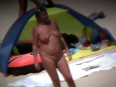 Chubby barley old enough women filmed on a nudist beach