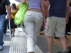 Sexy brunette with nice tits, a nicer ass on a sidewalk seachshhh the vid