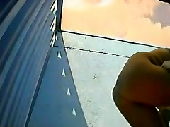 Beach dressing room voyeur video starring a big balloon tits chick