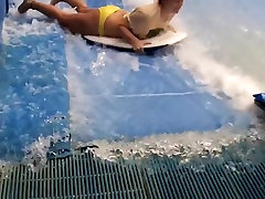 Sexy flowrider is demonstrating her tiny with big ass in aqua park