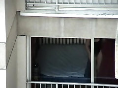 Opened window allows us voyeur babes ass in thong