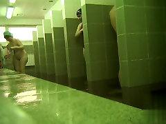 girl displays cameras in public pool showers 20