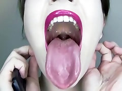 Her tongue is a actually weird color yet strangely arousing