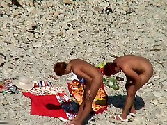 Two tstoo girk sluts naked on a beach