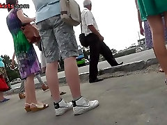 Upskirt voyeur scene at the bus stop with awesome lady
