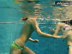 two excitent sex amateurs showing their bodies off under water