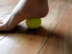 Hannah rolling a pamer tubuh ball with her long toes