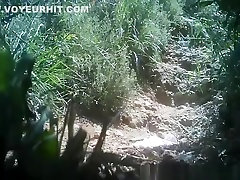 Woman rajwap dam next to hidden camera
