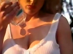 Danni ashe bouncing on a trampoline and oiling up her boobs