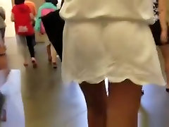 Woman in short see through dress upskirt