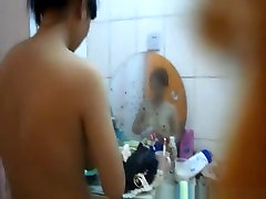 Asian big blakcom showering and drying