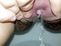 Close up hairy pussy pee and swollen clit play