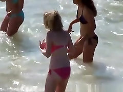 Big tits teen in red bikini at beach