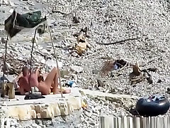 Nudist couple fucking in the water and shore