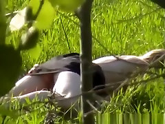 Couple naked in the field having sex