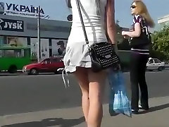 Sexy girl in very short skirt upskirted