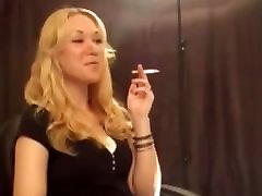 Beautiful Blonde Smoking while Talking with Friend