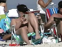 Couple split by Strangers on a brazzer shoe shopping beach