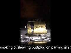 Smoking & showing buttplug in snow at parking