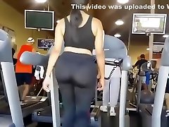 Big ass woman in tight sports pants at gym