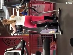 Tattooed blonde in red miss grosse pants exercising