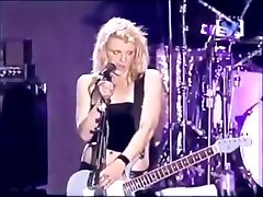 Hot rockstar plays a song with her boobs out in the open