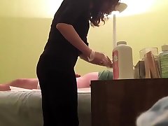Hidden cam reveals a wax master giving handjob to horny client
