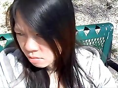 ASIAN GIRL SUCKING DICK IN A PUBLIC PARK