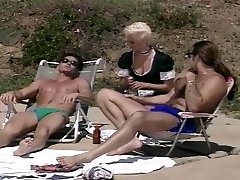 Horny Blonde Maid Helps These Suntanning Dudes Oil Up