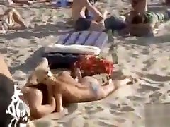 Doing the mom and teens lebian on a crowded beach