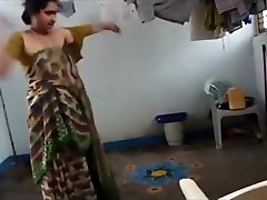 Indian wife with saggy tits puts on her clothes