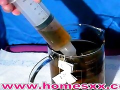 Cutouts-Enema girl testing Glycerin and Tea Enemas