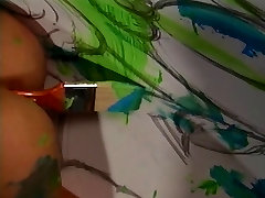 Horny lesbian sluts roll around and fuck with paint
