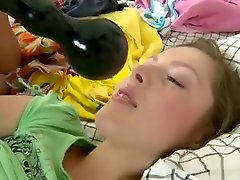 Sweet teen Kacie has a black dildo stretching her ass, paving the way for a big cock
