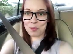 Girl in glasses farts in her car