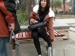 Beautiful Teenager Black Nylon Soles Sitting On A Bench