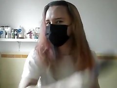Girl painting her hair in surgical real pie and gloves