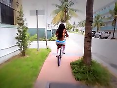 Cute ebony babe rides a big cock after riding her bike