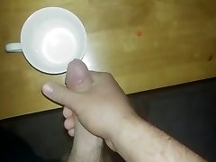 Watch me stroke my big cock and bust a massive load on kitchen table