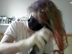 Girl painting her hair in surgical keydon kross body heat movie and gloves