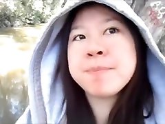 Asian girlfriend gives a public blowjob