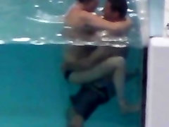 Another couple fucking in the pool