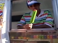 Ice cream man dips his popsicle in a young teen