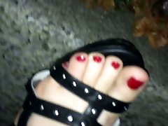 Walking in black heels with rivets