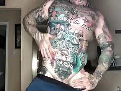 Tattooed beefy stud showing off his ass and jerking off