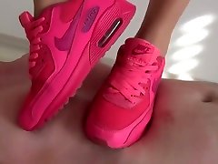 trampling in pink nike sneakers