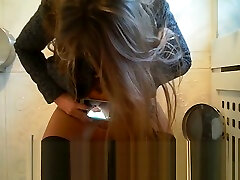 Russian teen taking ev amatr teen of her pussy while peeing at public toilet